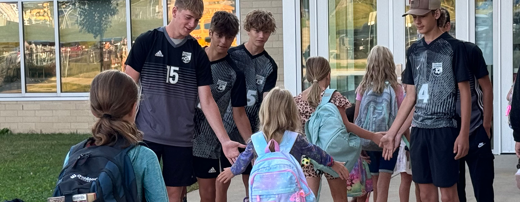 Boys Soccer Players Greet Elementary Students on 1st Day